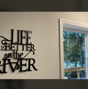Life is better on the river sign