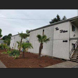 The palms Apartment sign